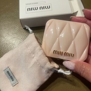 Miu Miu Blush Pink mirror with gold accent.